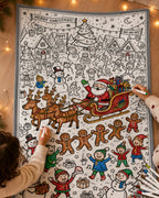 Plaid de Noël motif Village du Père Noël en cours de coloriage, avec le traîneau et les rennes